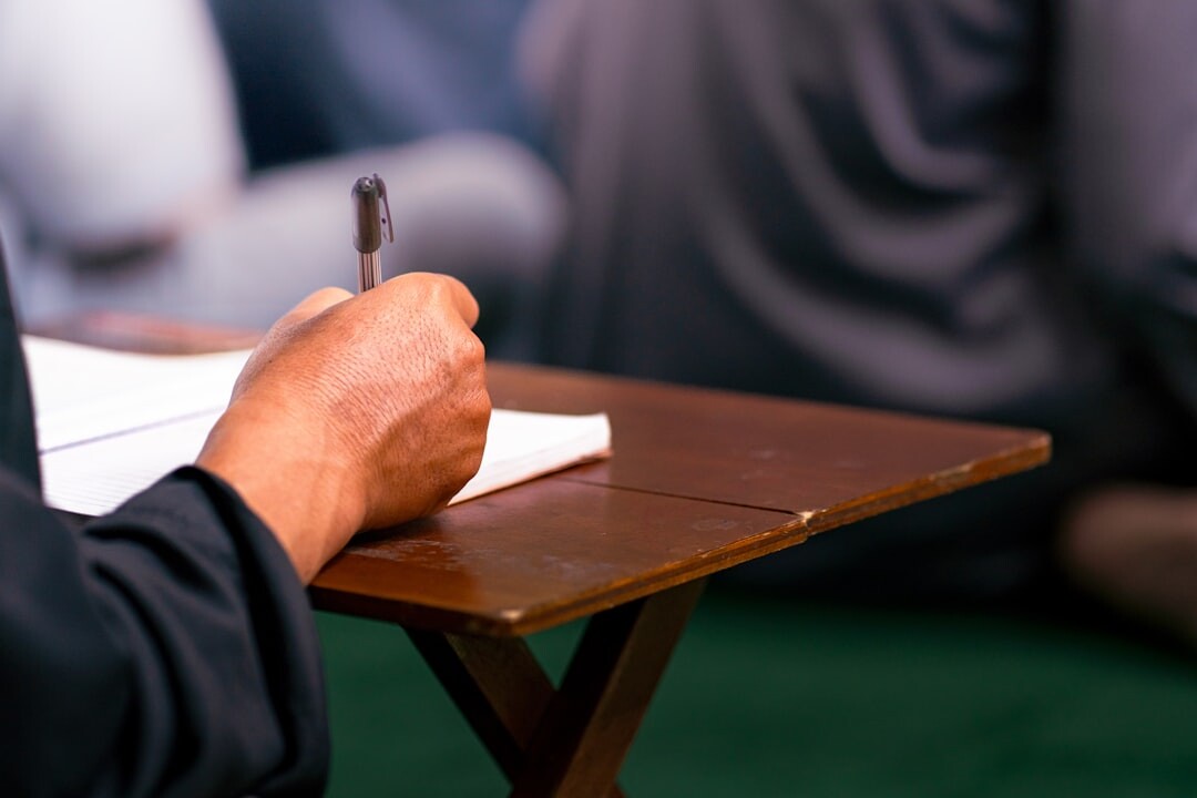 Journalist taking notes at a press conference