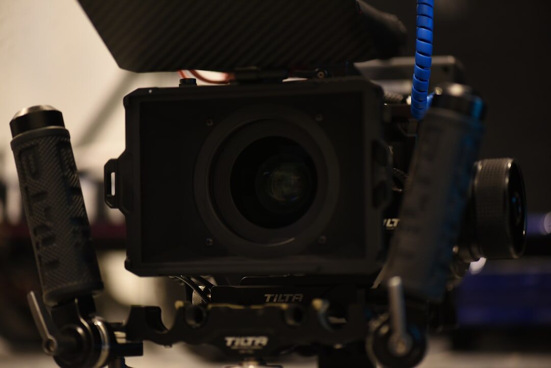 Cameraman operating broadcast camera on shoulder rig