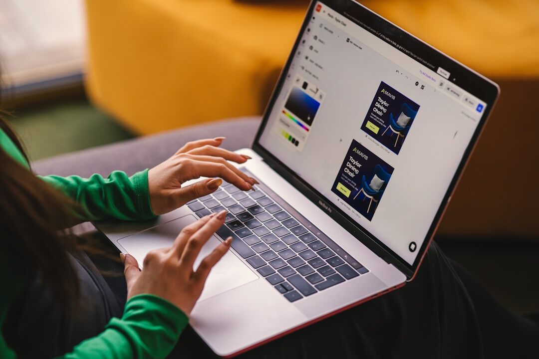 Journalist working on laptop with news workflow software